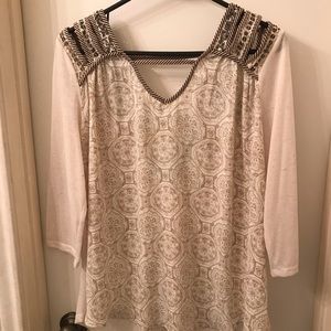Pretty blouse with unusual cut outs
